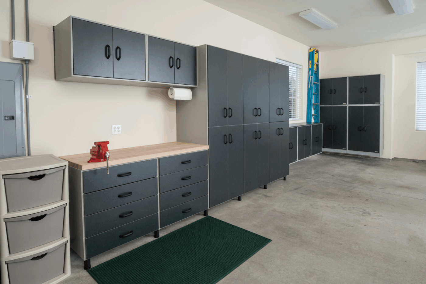 Large Garage Interior showcasing How workbenches and storage can be used along the back wall in a garage