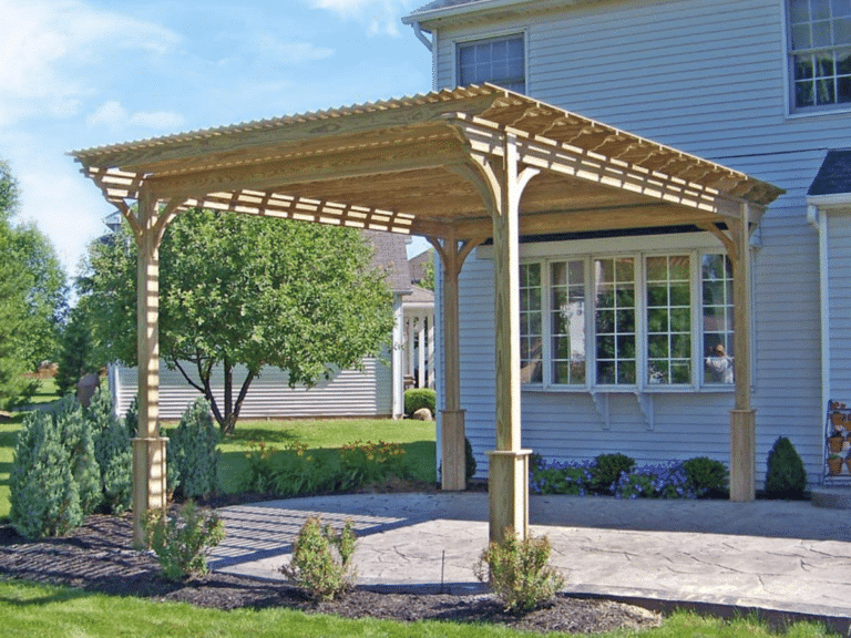 wooden pergola next to a brown house in virginia from premier building solutions