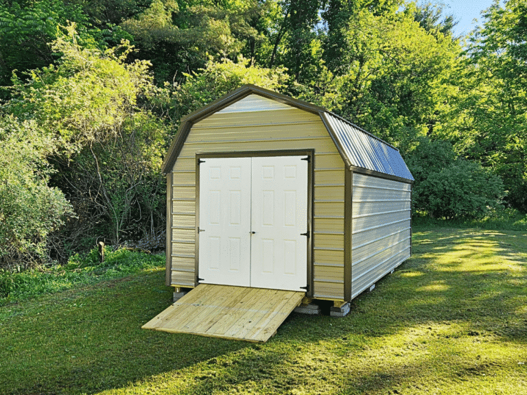 tan barn shed made from metal with double doors and a ramp