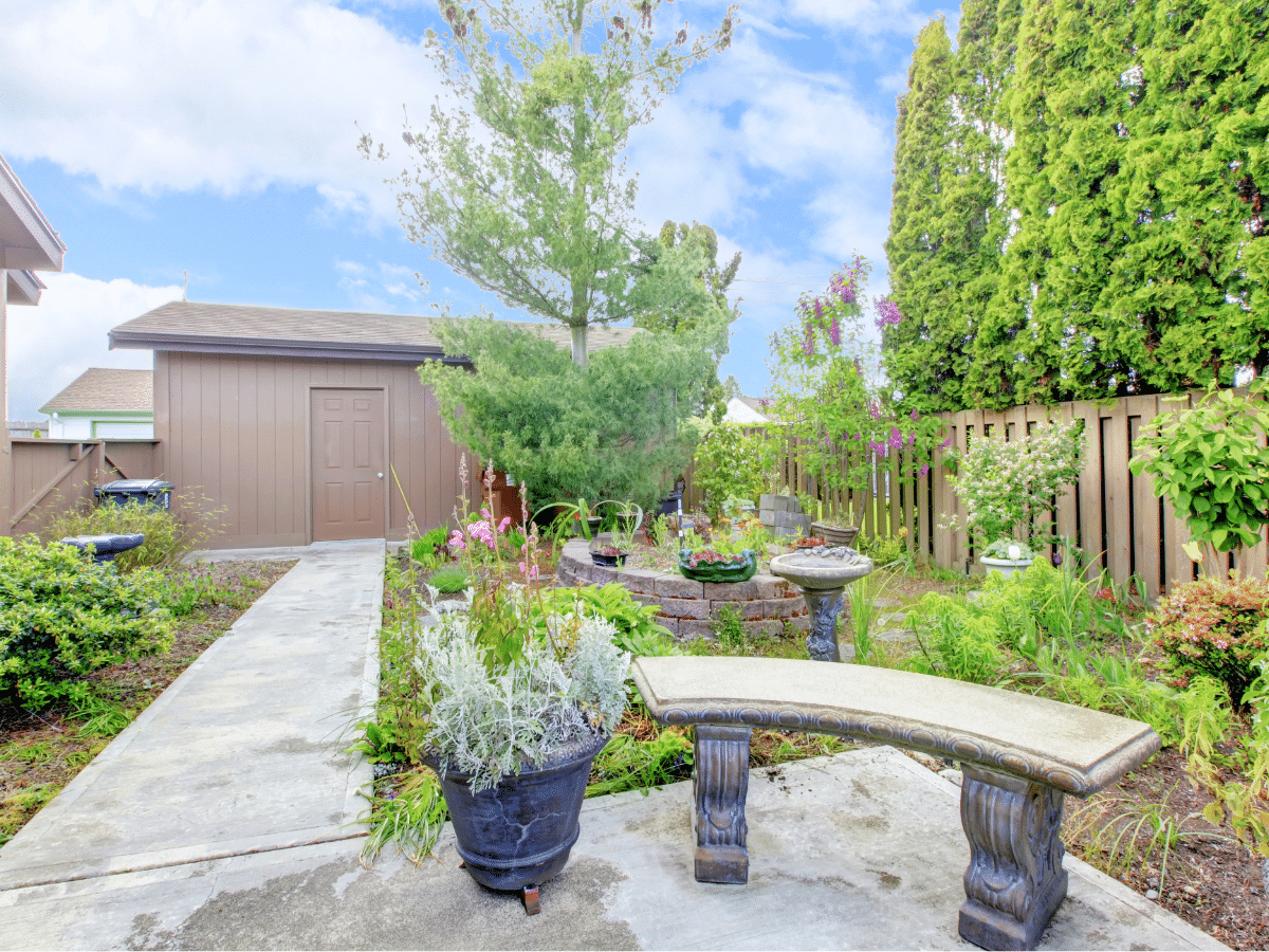 outdoor seating outside a backyard shed